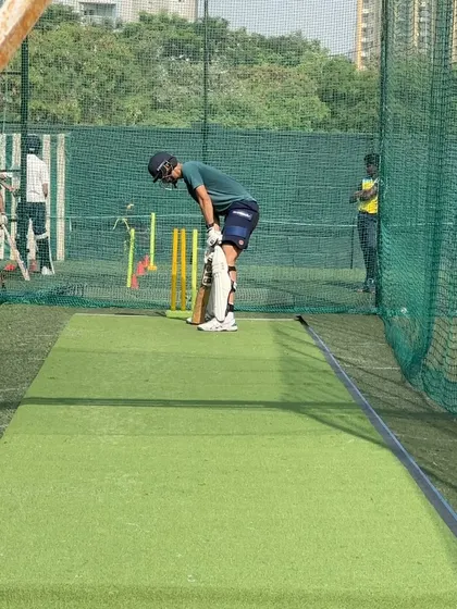 A moment of reset between shots during a power-hitting drill.