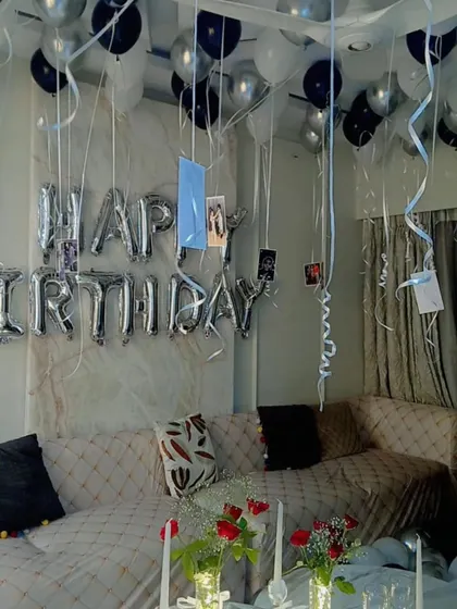 A close-up of the personal touches in our room decoration service, where we hang your favorite photos from the balloons.