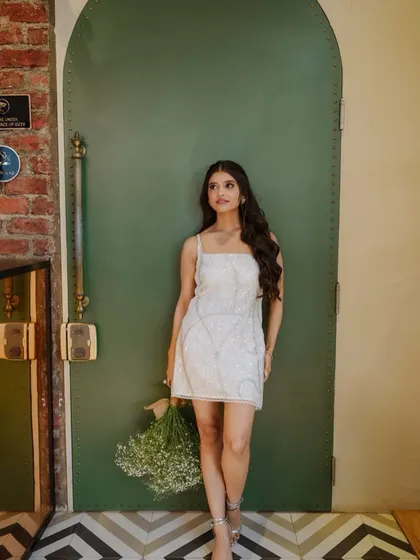 A chic portrait of Utsavi. Her minimal makeup and elegant dress create a very modern and sophisticated bridal look.