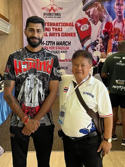 Another photo with my master at an international event. His guidance has been invaluable on my journey.