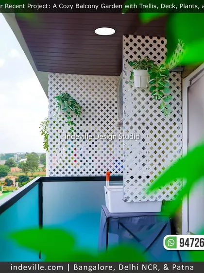 A view of the balcony trellis from a different angle, showing how it provides privacy and a green backdrop. The hanging plants on the trellis add life and color to the wall.