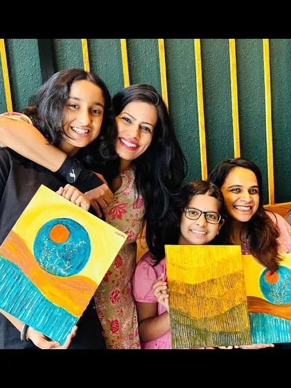 A group of happy participants with their finished Wabi Sabi paintings. Each piece is a unique expression of finding beauty in imperfection.