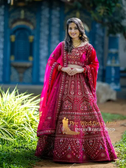 My bridal-style red lehenga is perfect for creating grand and opulent pre-wedding portraits. The detailed embroidery and rich color make it a truly show-stopping piece.