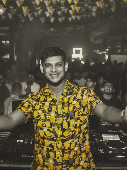 A happy, welcoming shot from behind the decks. My goal is to make everyone feel free and have a great time.