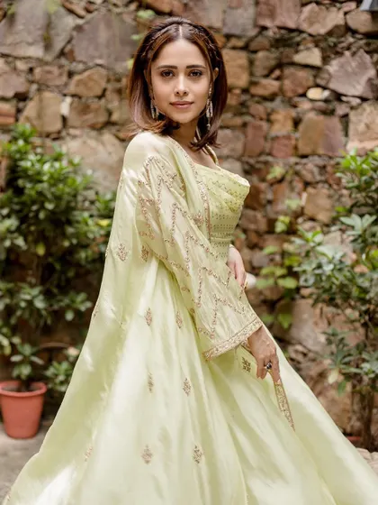 Another angle of this gorgeous lime green set, showing the delicate embroidery on the cape. It’s all in the details.