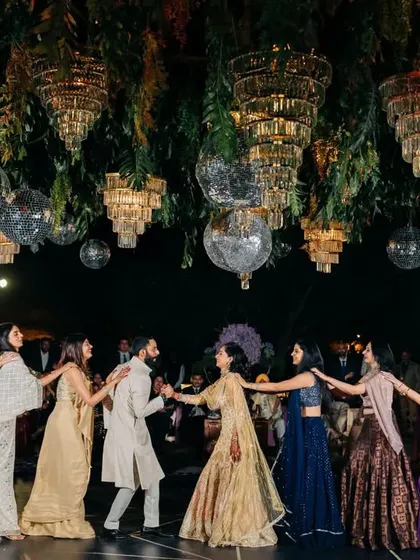 A beautiful group formation with the couple at the center, surrounded by their friends.