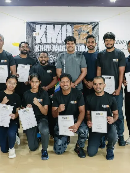 The certified group from our Third-Party Protection Seminar in Mangalore, holding their completion certificates after a day of intensive training.