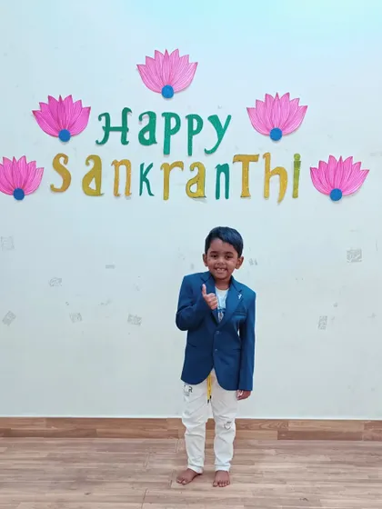 A thumbs-up for the Sankranti celebration. This little Aster is all smiles and ready for the festivities.