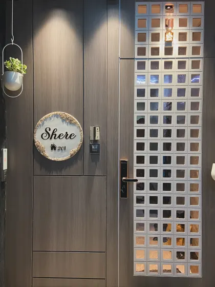 A direct shot of the safety door from the Santacruz project, highlighting the grid design with reflective squares. This custom door is both a security feature and a key design element.