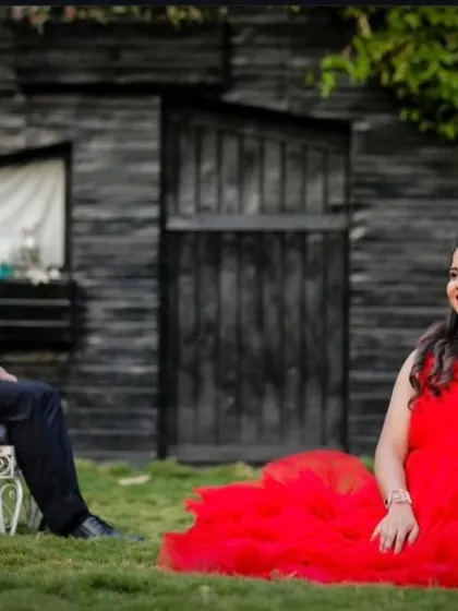 A relaxed yet posed shot showing the contrast between his dark suit and her bright dress. I provide outfit options for both men and women.
