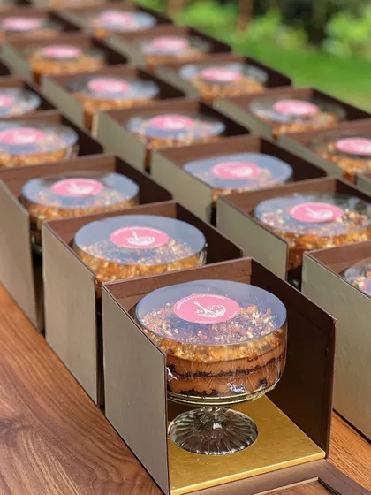 The dessert trifles for a baby announcement, neatly arranged in their boxes. We ensure every element, from the dessert to the packaging, is flawless for your special news.