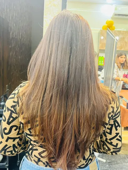 Another angle of the feather cut, highlighting the texture and movement it adds to the hair.