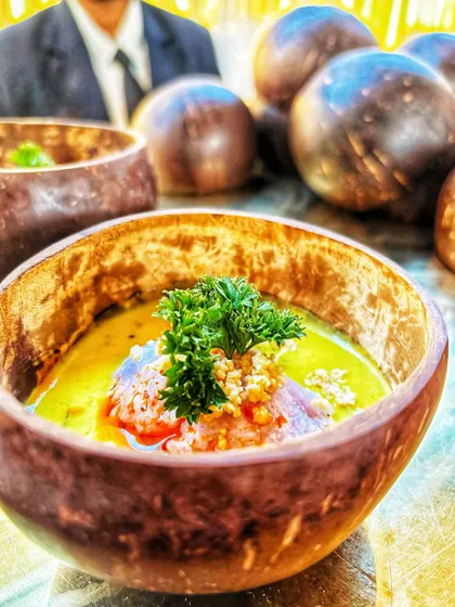 This dish features fragrant Blue Jasmine Rice paired with a creamy Vietnamese curry, served in a rustic coconut bowl. It's an example of the authentic and beautifully presented global cuisine I offer.