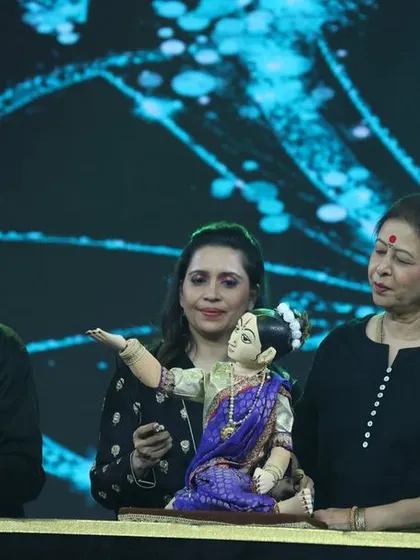 A family portrait on stage. My parents, my wife, and I, all sharing our passion for puppetry with the audience.