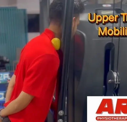 A client performs an upper trapezius mobilization exercise against a machine. This is another variation of a key exercise we teach for relieving neck and shoulder tension.