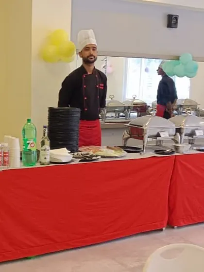 Our team ready to serve at a birthday party at DSR White Waters, with a full buffet line prepared for guests.