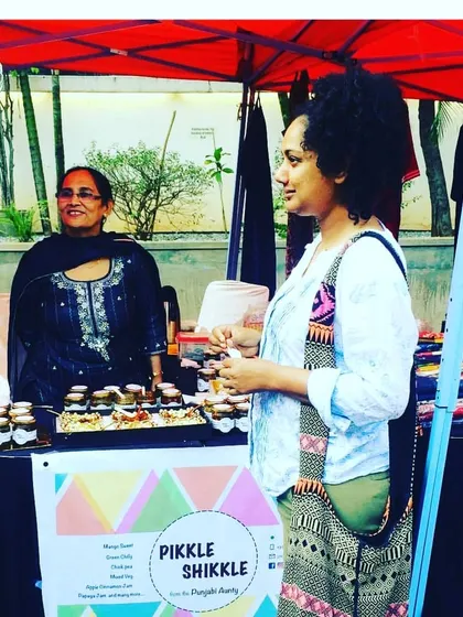 Interacting with customers at one of our first stalls. The positive feedback from the start encouraged me to continue.