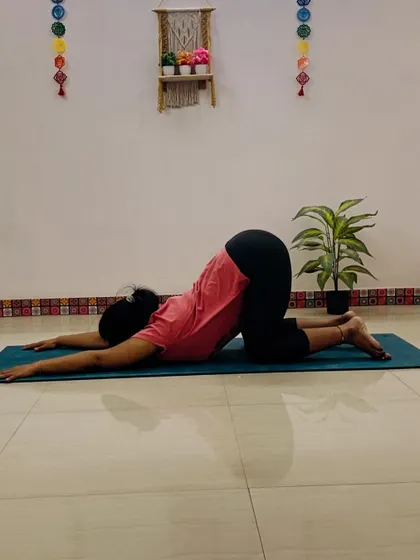 A client in Anahatasana (Puppy Pose), a wonderful stretch for the shoulders, spine, and chest. It's a gentle heart-opener that helps relieve tension.