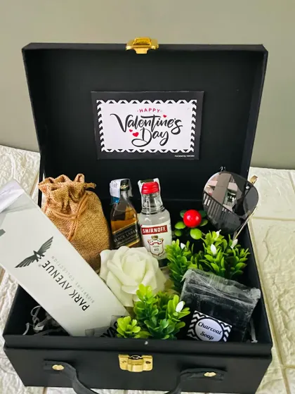 Another option for a men's gift hamper, this black suitcase box includes a Park Avenue kit, miniature alcohol, and a charcoal soap.