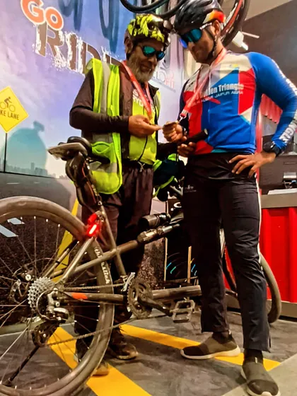 Checking the brevet card at a control point. This is a crucial part of every official BRM ride.