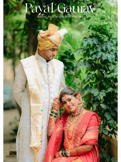 A tender portrait of the groom looking at his seated bride, their hands connected, symbolizing the start of their life together.