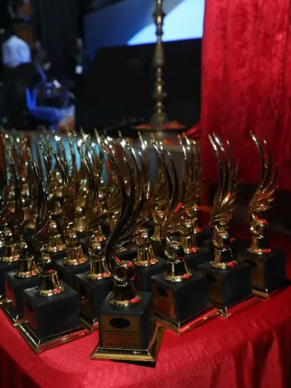 A table laden with trophies, ready to be awarded to our deserving students. We believe in recognizing and celebrating the hard work and achievements of every performer.