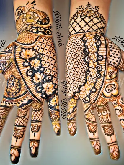 An intricate Indo-Western design that combines the best of both worlds. You have the bold peacock and floral elements paired with delicate, modern patterns.