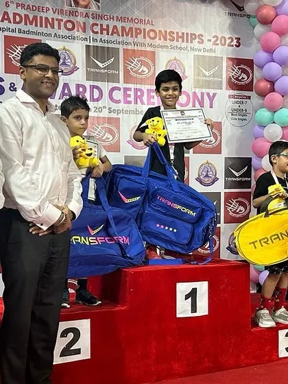 The award ceremony for the U-7 Boys Singles at the Delhi State Badminton Championship, with our young champion Advit Mishra receiving his prize.