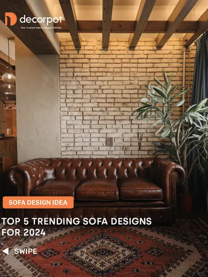 This image showcases a trending sofa design for 2024, featuring a classic leather Chesterfield against an industrial-style brick wall. This combination of rustic and refined elements creates a unique and stylish living space.