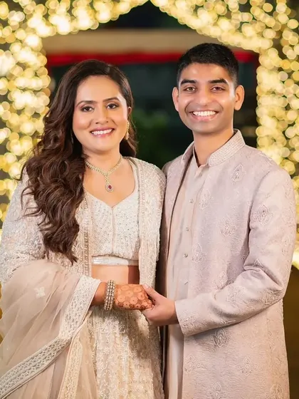 Posing in a tunnel of lights, the bride's makeup looks flawless. The soft glam approach ensures she looks great in every lighting situation.
