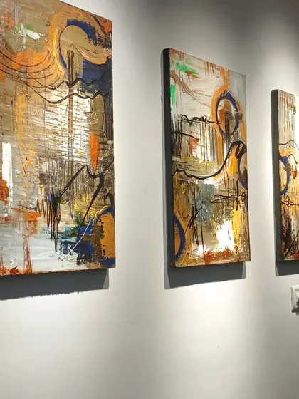 A triptych of contemporary abstract art, perfect for adding a cohesive yet dynamic element to a long wall. The flowing lines and metallic accents connect the three panels into a single, fluid statement.