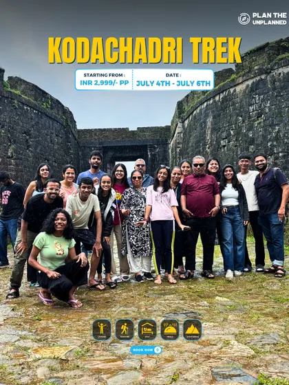 Our group posing in front of a historic stone structure on the Kodachadri trek. This journey is a mix of natural beauty and ancient heritage.