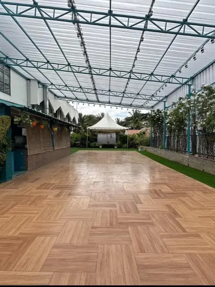 The spacious wooden floor of the Terrace Garden, a versatile base for any event layout, from dance floors to dining setups.