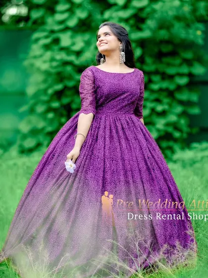 Another angle of the purple lace ball gown, showing the delicate texture and the way the light filters through the fabric.