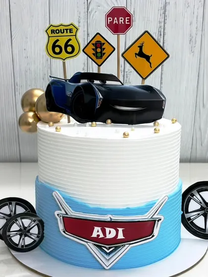 Full speed ahead for this Cars-themed cake. Featuring Jackson Storm and Route 66 signs, it's perfect for a little racer's big day.