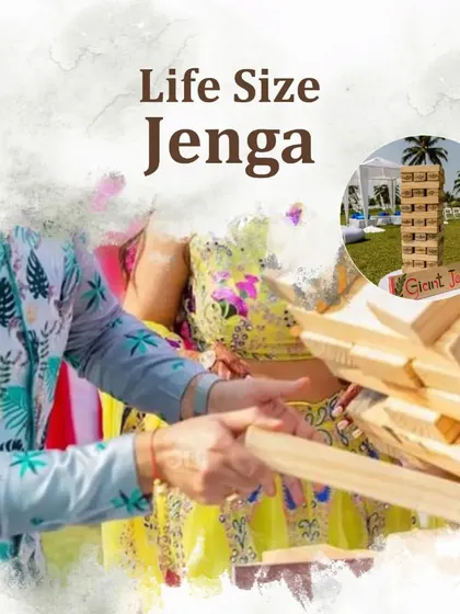 A giant Jenga set for outdoor fun, a great icebreaker and a source of much laughter during a daytime wedding event.