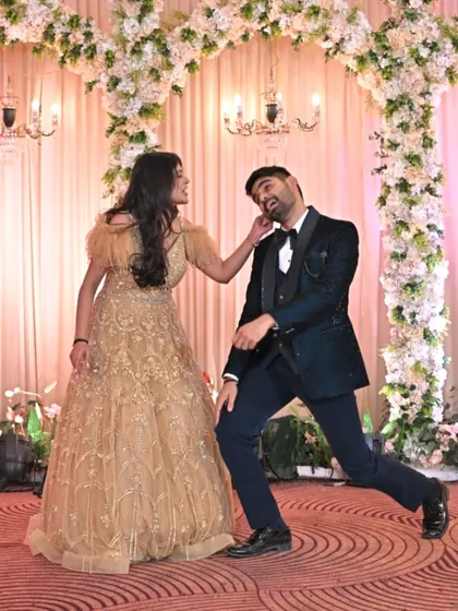 It's all about having fun together. This playful moment from a couple's routine shows that the best wedding dances are the ones filled with laughter and your unique personality.
