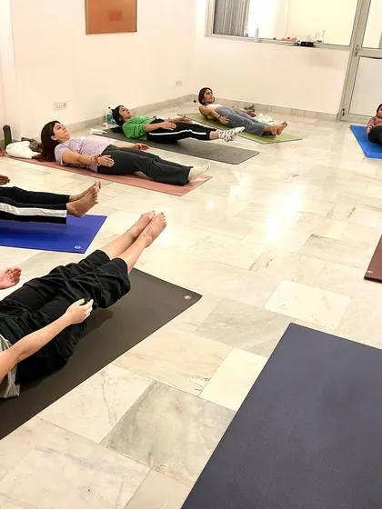 Students relaxing in Savasana after a powerful workshop. This is a crucial time for the body and mind to absorb the benefits of the practice.