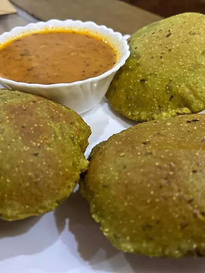 A healthy twist on a classic, these are Palak Pooris served with Aloo Sabzi. The spinach adds nutrition and a beautiful color to the pooris.