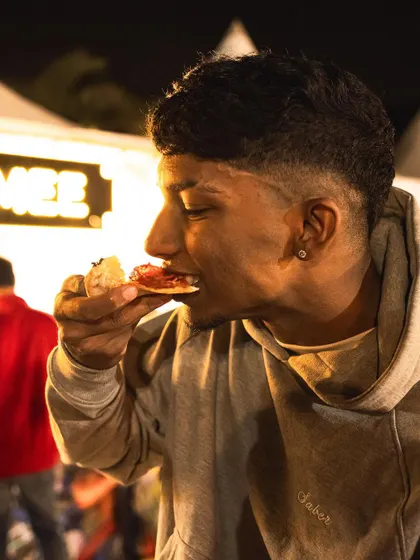 Enjoying a slice under the festival lights. We bring the full Brik Oven experience to events like the Gin Explorers Club.