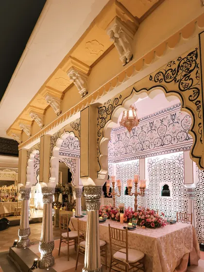 The long banquet tables were set under the beautiful arches of the venue. The architecture itself became a key part of the decor, enhanced by the soft lighting and elegant tablescapes.