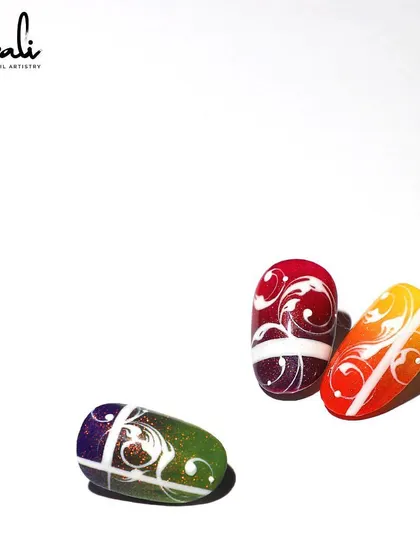 A vibrant set of swirl designs on a colorful ombre base. These are perfect for making a statement.