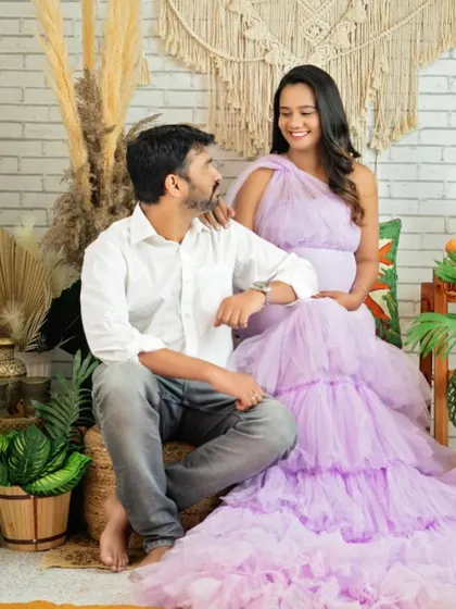 A sweet, interactive moment between the couple. Her happy expression shows how comfortable and at ease she feels.