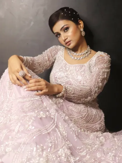 An angelic look in a beautiful light lavender gown. The makeup is soft and ethereal, with a touch of sparkle in the hair to complete the dreamy vibe.