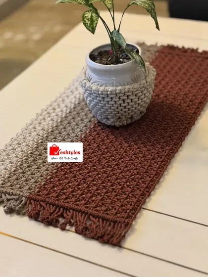 A full view of the ombre table runner. The gradual change in color is created by carefully blending different shades of cotton cord.