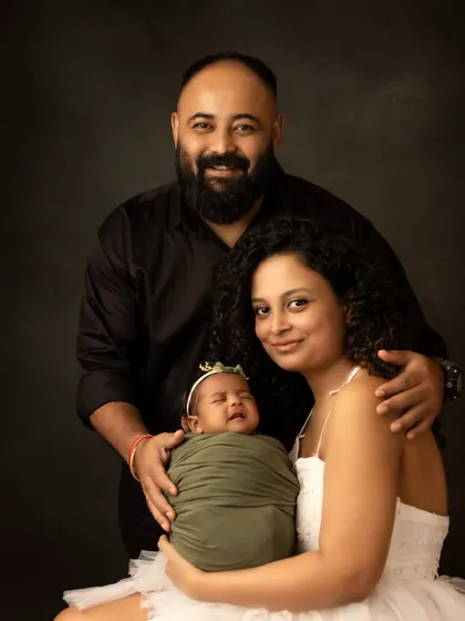 Even a little cry can make for a real and memorable moment. This family portrait captures the reality of life with a newborn in a beautiful and honest way.