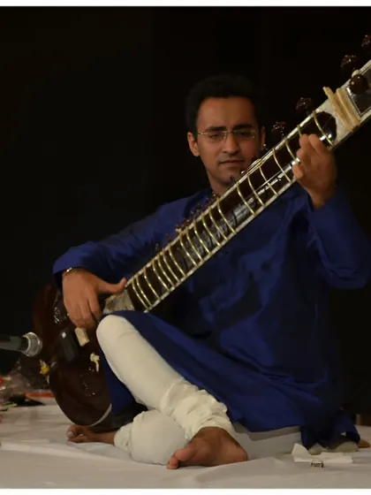 A close-up of my expression during a deeply melodic passage at the India Habitat Centre.