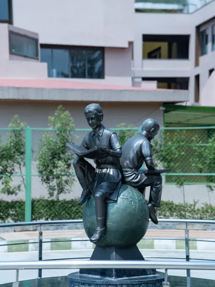 A closer view of the bronze sculpture, showcasing the detailed craftsmanship. Such artistic installations enrich the campus environment and serve as daily inspiration for the student community.