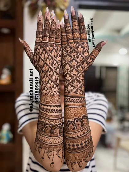 A beautiful back-of-hand bridal design featuring a full jaal pattern with leafy motifs, perfect for a bride who loves detailed work.