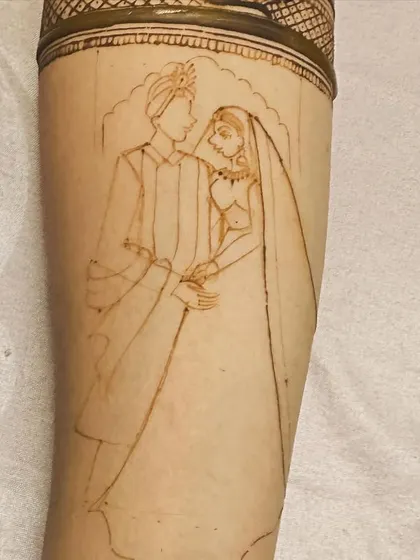 The initial outline of a bride and groom portrait. This is the first step in creating a detailed and realistic figure.
